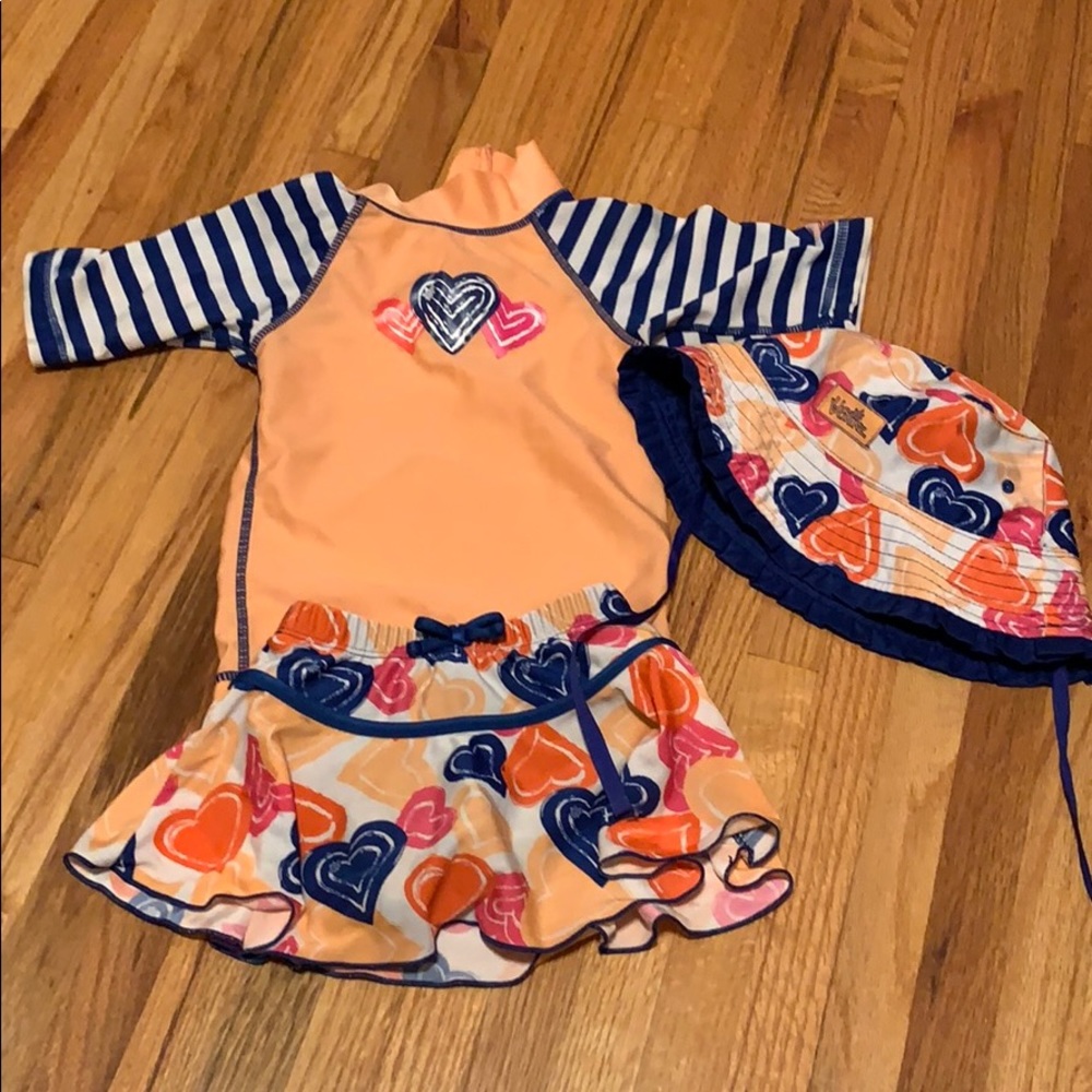 USkinz size 2T swimsuit with reversible hat.
